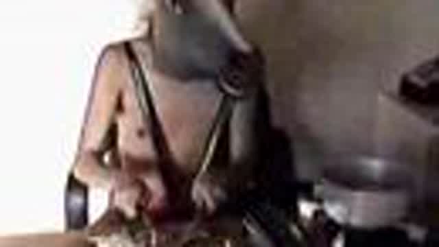 Dancing man wearing a horse mask cooks wild mushrooms. Dancing man wearing a horse mask cooks wild mushrooms.