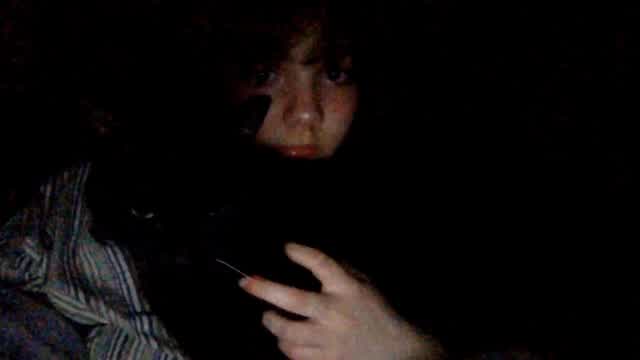 mentally unstable and retarded guy carressing his black cat nervously