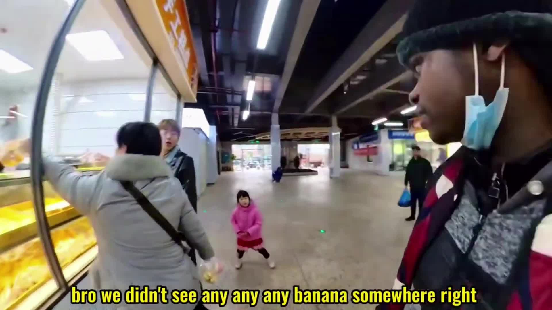 Little Chinese girl sees a Black man for the first time